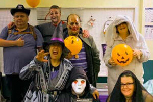 Image of Our Harbour staff and residents in Halloween costumes taken in 2021