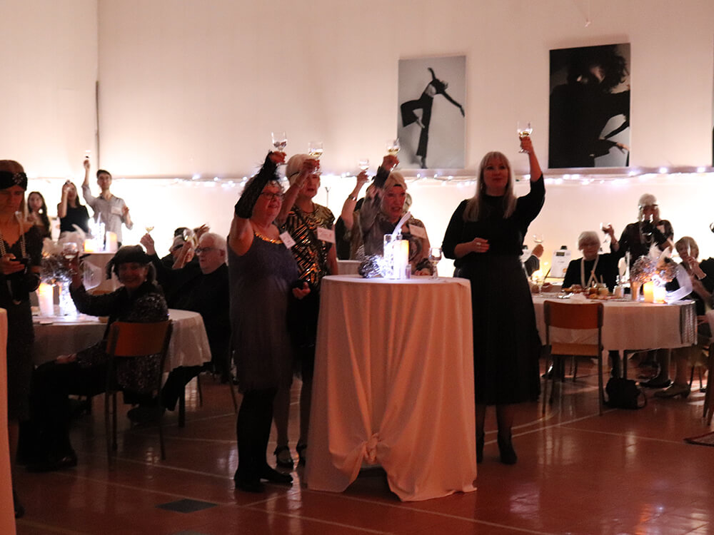 Patrons making a toast at Our Harbour's 20th anniversary gala