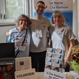 Members of our staff sharing information about Our Harbour